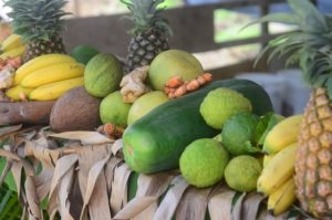 display of exotic tropical caribbean fruits on banana straw during international creole day festival in st lucia
